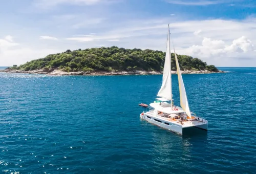 Side view of the Elizabeth private sailing yacht cruising along the Phuket coastline with Phuket Travel Store