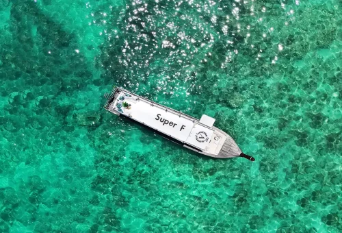 Super-F’s deluxe cabin and sun deck with Phuket Travel Store branding