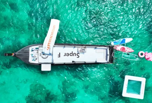 Super-F luxury boat interior with comfortable lounge and scenic backdrop