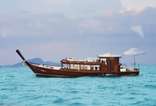 Luxury longtail boat Super-S with modern design and guests in Phuket by Phuket Travel Store