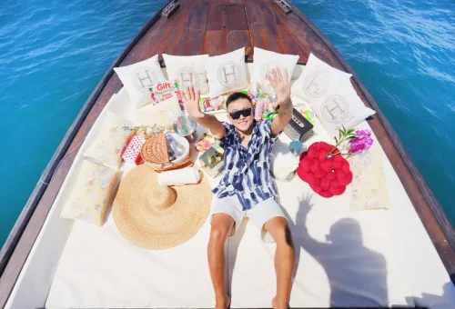 Super-S boat interior with plush cushions, shaded areas, and stunning sea views