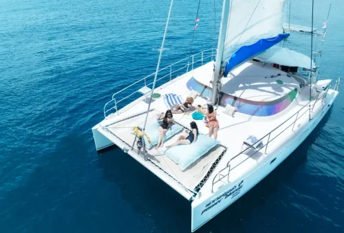 Super-V catamaran on a private ocean cruise under sunny Phuket skies