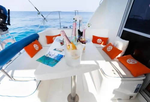 Guests enjoying the deck of Super-Y catamaran on a luxury Phuket cruise