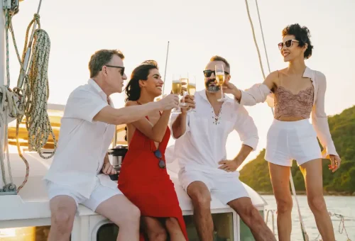 Super-Y catamaran with wide lounging space and sleek white sails in Phuket