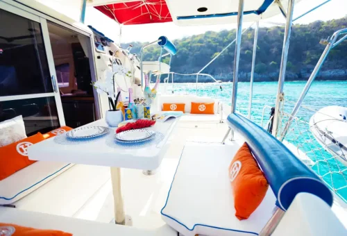 Spacious deck and shaded seating on the Super-Y private catamaran