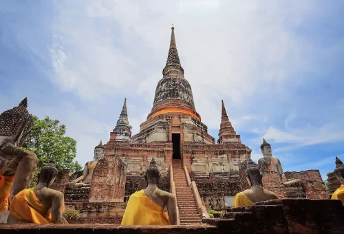 Traveler exploring Ayutthaya's ancient ruins and tasting traditional Thai food on the Ancient Ayutthaya Food & History Tour