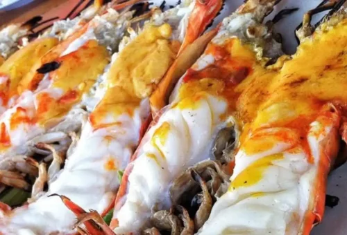 Traveler exploring Ayutthaya's ancient ruins and tasting traditional Thai food on the Ancient Ayutthaya Food & History Tour