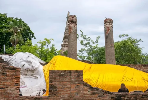 Visitor enjoying herbal drinks while exploring Wat Lokayasutharam and exploring UNESCO World Heritage ruins