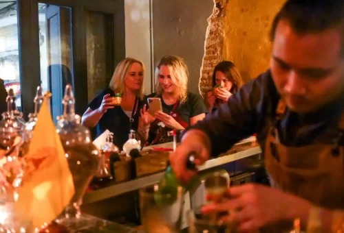 Guests dancing and enjoying live music at a hidden Bangkok cocktail lounge