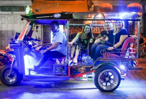 Tuk tuk driving through Bangkok at night during bar crawl with Phuket Travel Store