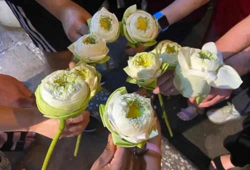 Guest enjoying guay tiew gai (chicken noodle soup) at Samyan Night Market during Bangkok Midnight Food Tour by Tuk Tuk with Phuket Travel Store