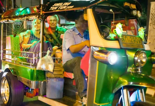 Guest enjoying pad thai at Bangkok’s Chinatown during Bangkok Midnight Food Tour by Tuk Tuk with Phuket Travel Store