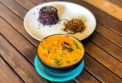 Vegan Thai yellow curry with black rice and pickled vegetables