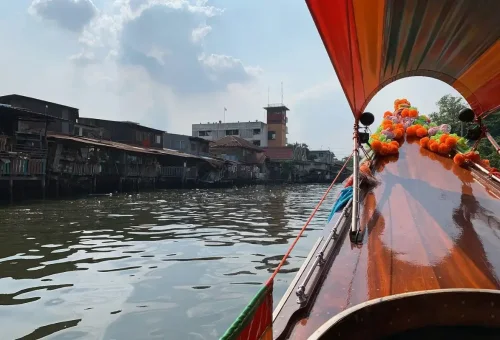 View from longtail boat of Bangkok’s rustic canal homes