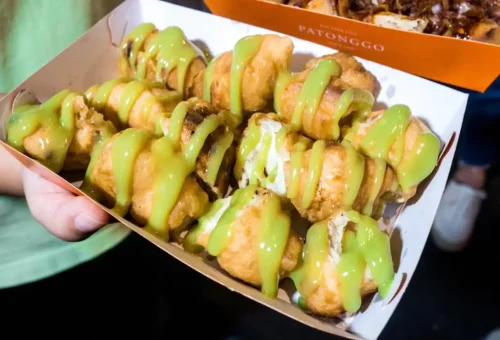 Thai fried dough sticks with pandan custard drizzle in Bangkok