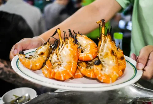 Grilled river prawns served fresh at a Bangkok night market