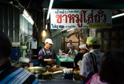 Late-night street food stalls in Talad Noi — a delicious start to the Bangkok Nightriders tour.