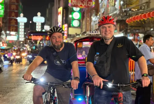 Happy riders at Yaowarat Road — where Bangkok’s energy never sleeps.