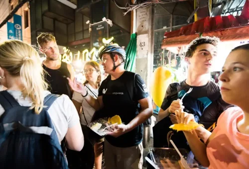 Sampling tropical treats like mango sticky rice with local insight from your guide.