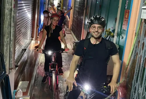 Pedaling through narrow sois lined with shophouses — the real Bangkok up close.