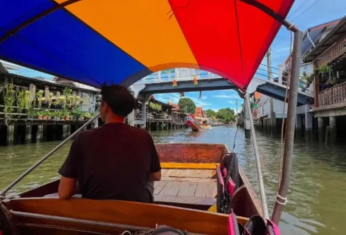 Longtail boat exploring Bangkok’s historic canals
