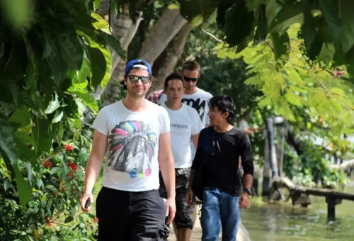 Guided walking tour through a green local Bangkok community
