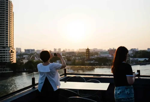 Sunset over Thonburi from a hidden rooftop viewpoint