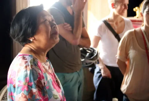 Local elder sharing stories with tourists during the tour