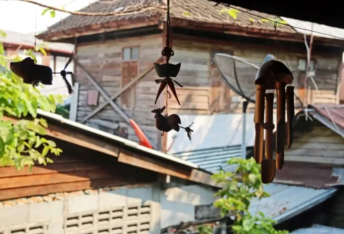 Traditional wind chimes hanging in a Bangkok heritage house