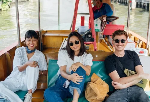 Tourists relaxing on a boat along Bangkok's canals