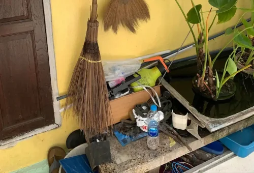 Everyday items outside a local home in Bangkok Chinatown