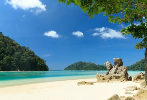 Tropical beach with turquoise water and dramatic rock formations on Surin Islands, Thailand