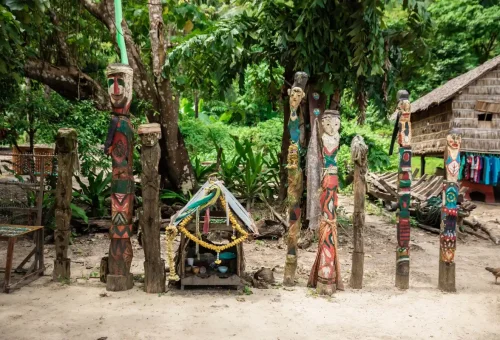 Traditional spirit poles and offering shrine in a Moken Village on Surin Islands