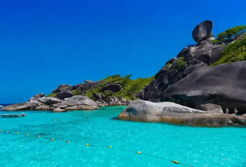 Iconic Sail Rock rising above turquoise water at Similan Islands.