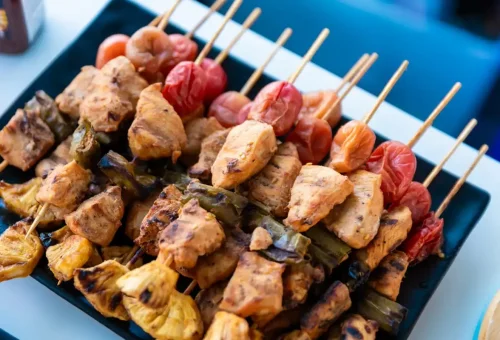 Thai grilled chicken skewers served on catamaran during island tour