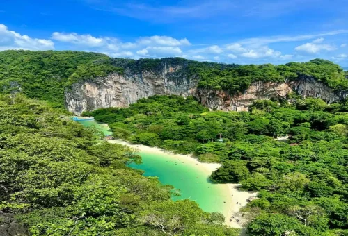 Aerial view of Hong Island lagoon surrounded by lush green cliffs in Krabi