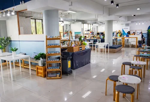 Spacious lounge area with seating and refreshments at tour office