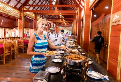 Tourist enjoying Thai buffet lunch on Koh Panyee island