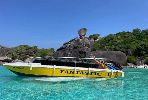 Speedboat Fantastic at Similan Islands Phuket with turquoise waters and iconic Sail Rock.