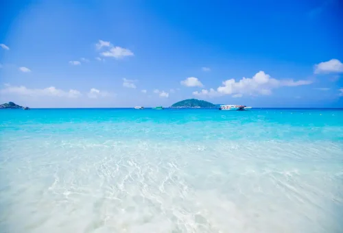 White sandy beach and turquoise waters of Similan Islands, Thailand.