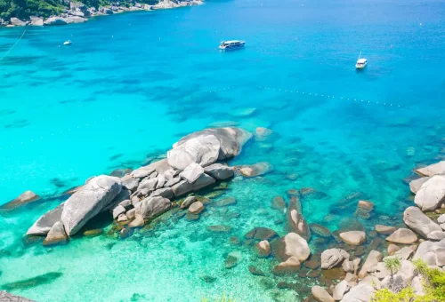 Rocky coastline with clear turquoise waters at Similan Islands National Park near Phuket.
