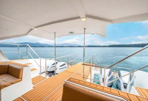 Rear deck of Wow Andaman boat with twin Honda engines and sea horizon.
