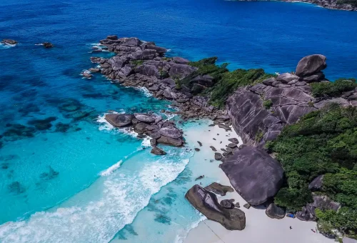 Granite rocks and turquoise surf at Donald Duck Bay in Similan Islands, Thailand.