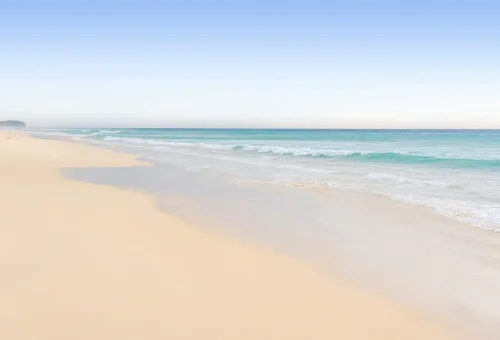 Wide stretch of Khao Na Yak beach with turquoise waters.