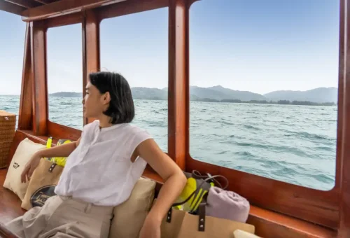 Guest relaxing on private longtail boat cruising in Khao Lak