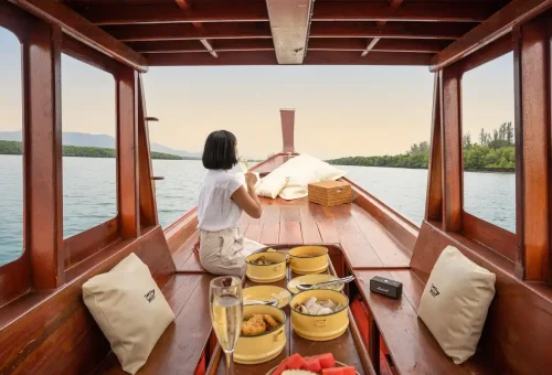 Private longtail boat with Thai lunch setup for Khao Na Yak tour Phuket Travel Store.
