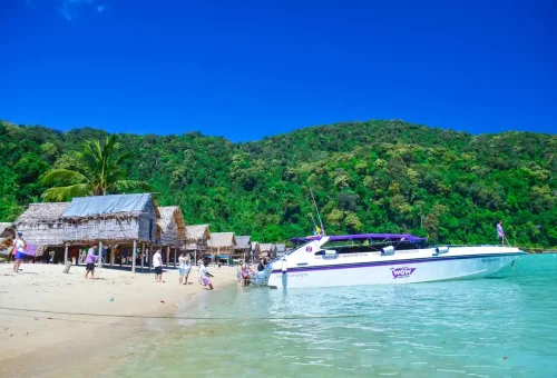 Speedboat arriving at Surin Islands beach near Moken village.