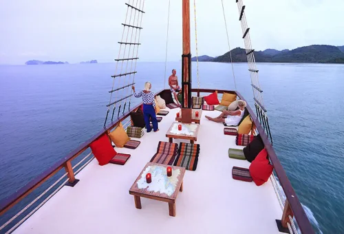 Sunset sailing lounge with colorful pillows on The Cruise Day Tour Phuket