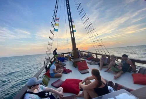 Families and travelers watching the sunset from Phuket boat deck