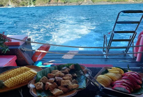 Fresh tropical fruits and snacks served on board during the Relaxing Sun and Sunset Tour Phuket with Phuket Travel Store.